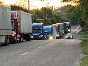 Trucks were backed up on Dade Street last week, causing concern among residents of the neighborhood. Nassau Terminals said it has worked with its customers and hopes the problem has been resolved. Submitted photo