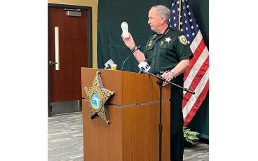 Nassau County Sheriff Bill Leeper holds up a baby bottle similar to the one laced with fentanyl that was given to a nine-month-old baby. Photo by Holly Dorman/News-Leader