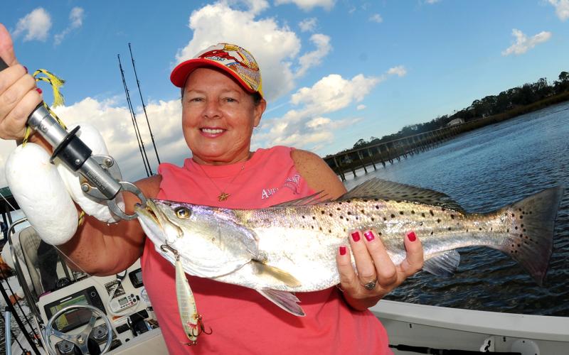Slow trolling a hard plastic plug produced this nice winter sea trout for Glenda Crosby. Photo by Terry Lacoss